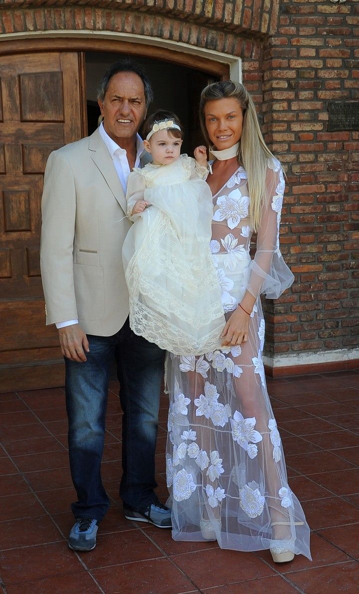 Scioli junto a Berger en el bautismo de su hija Francesca.