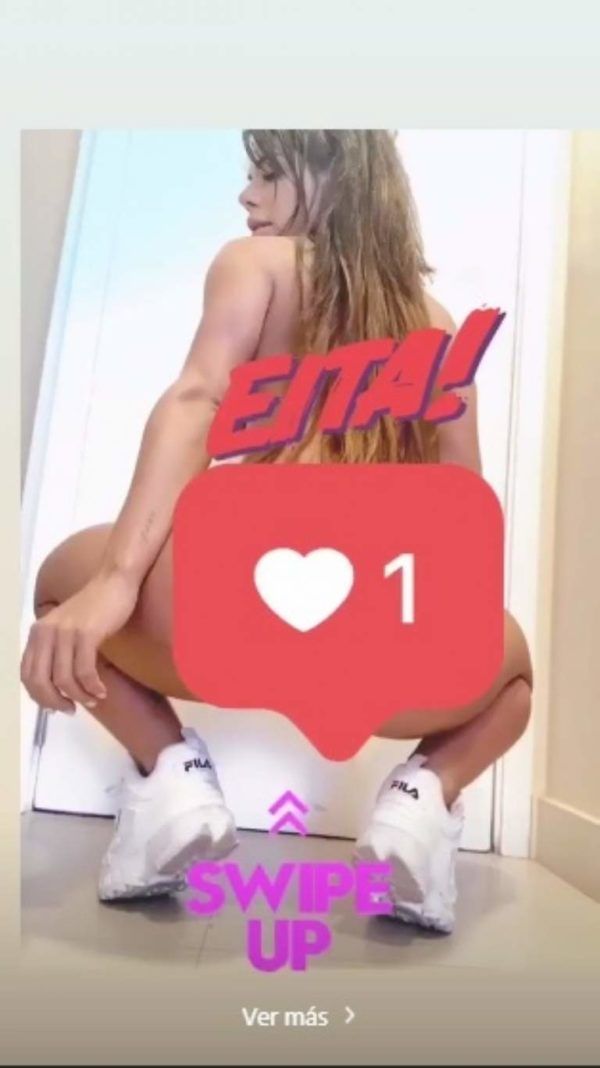 Suzy Cortez posa agachada y apenas se cubre con algo insólito