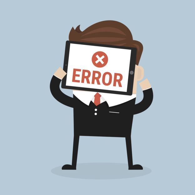 muñeco con letrero que dice error.