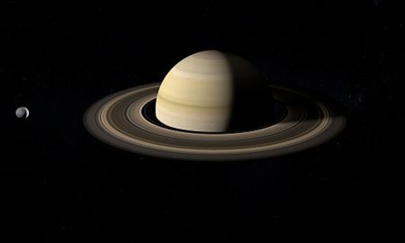 Saturno y Mimas, una impactante luna con forma de ojo. Saturno y Mimas, una impactante luna con forma de ojo.