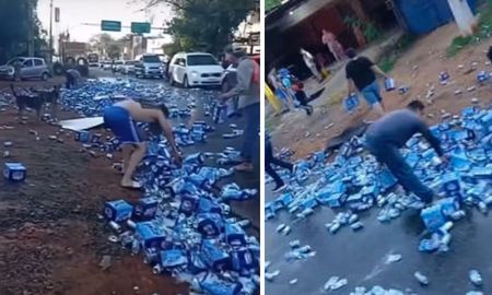 Vecinos aprovecharon el accidente para llevarse las latas de cerveza caídas del camión. Vecinos aprovecharon el accidente para llevarse las latas de cerveza caídas del camión.