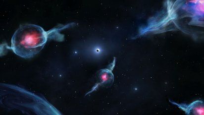 Ilustraci&oacute;n de artista de los objetos G, con sus centros enrojecidos y en &oacute;rbita alrededor del agujero negro supermasivo del centro de nuestra galaxia. El agujero negro est&aacute; representado como una esfera negra dentro de una regi&oacute;n blanca (por encima del centro del dibujo). Cr&eacute;dito: Jack Ciurlo.