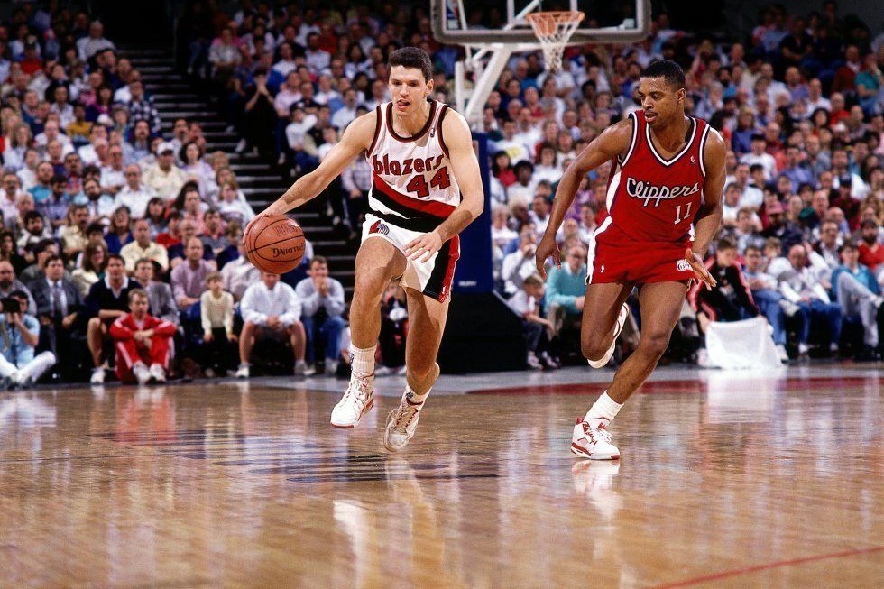 En la temporada 1989-1990, la de su debut en la NBA con los Portland Trail Blazers, jugó muy poco, y promedió 7,4 puntos en 12 minutos por partido. Tras 18 meses, cansado de ingresar pocos minutos por encuentro, pidió su traspaso de esta franquicia.
