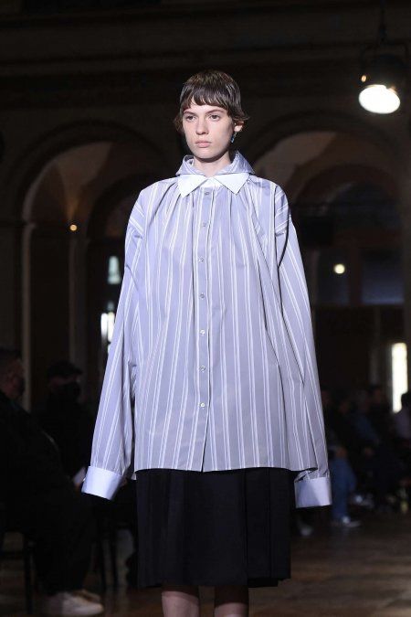 A model presents a creation by Raf Simons during the Womenswear Spring-Summer 2022 collection during the Paris Fashion Week on September 30, 2021.