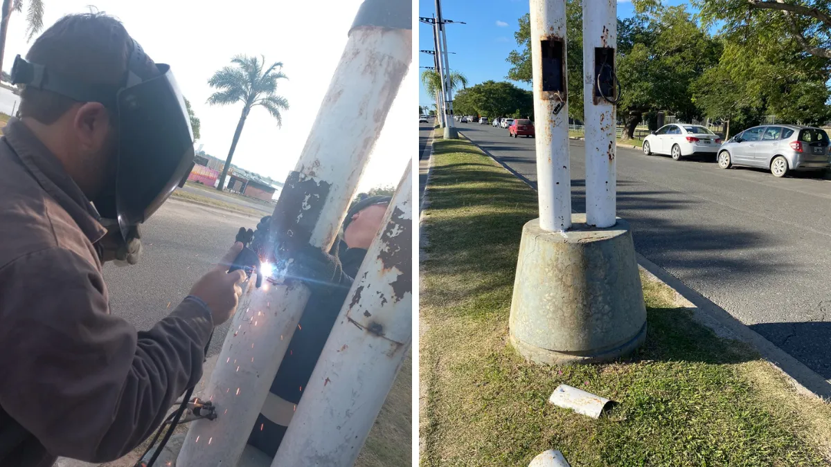Operarios municipales reparan una columna de iluminación, que había sido vandalizada, en la Costanera de Santa Fe.