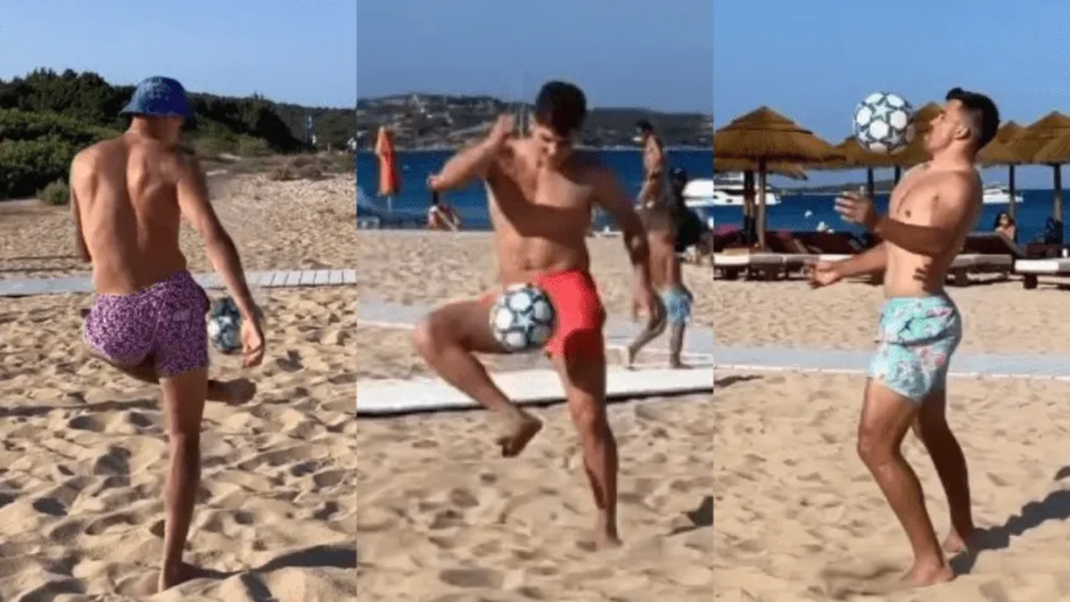 Julián Álvarez jugando al "que no caiga" junto a Marcos Acuña y Erik Lamela en Cerdeña.