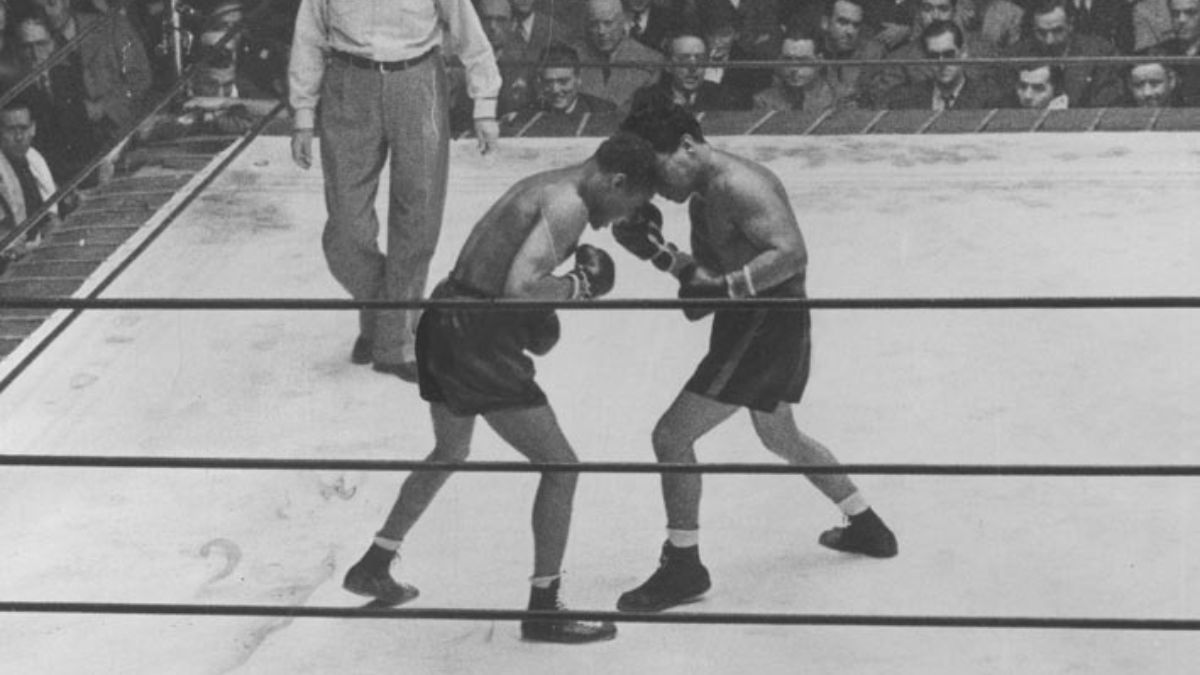Entre 1934 y 1939, Arizmendi (derecha) enfrentó cinco veces al fenomenal Henry Armstrong (cuyo nombre real era Henry Jackson), el único boxeador de la historia que reinó simultáneamente en tres categorías –pluma, welter y liviano, en ese orden–, en la época en que solo había ocho divisiones. La serie quedó 3-2 a favor del estadounidense. Entre 1934 y 1939, Arizmendi (derecha) enfrentó cinco veces al fenomenal Henry Armstrong (cuyo nombre real era Henry Jackson), el único boxeador de la historia que reinó simultáneamente en tres categorías –pluma, welter y liviano, en ese orden–, en la época en que solo había ocho divisiones. La serie quedó 3-2 a favor del estadounidense.
