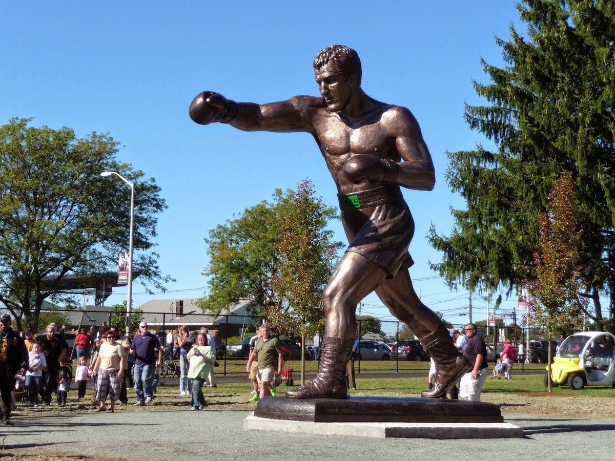 El 23 de septiembre de 2012 (en el 60º aniversario de su coronación), el Consejo Mundial de Boxeo (CMB) inauguró en Brockton, la ciudad natal de Marciano, una estatua de 6,70 metros de altura y dos toneladas de peso, erigida en su honor, y que se ubica en el Champions Park (Parque de los Campeones).