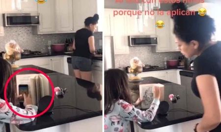 Una niña engaña a mamá, finge que lee mientras juega con su celular Una niña engaña a mamá, finge que lee mientras juega con su celular