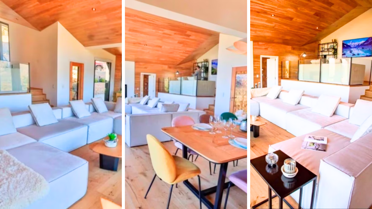 La casa de Iván de Pineda esconde uno de sus espacios más íntimos: un sillón individual junto a una salamandra. Desde aquí, una ventana enmarcada en negro se abre a un paisaje majestuoso de bosques y montañas.