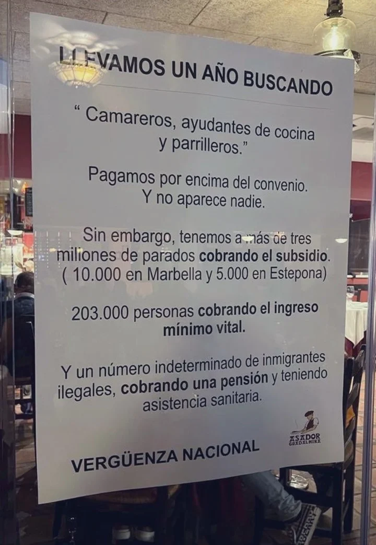 El cartel de El asador de Guadalmina.